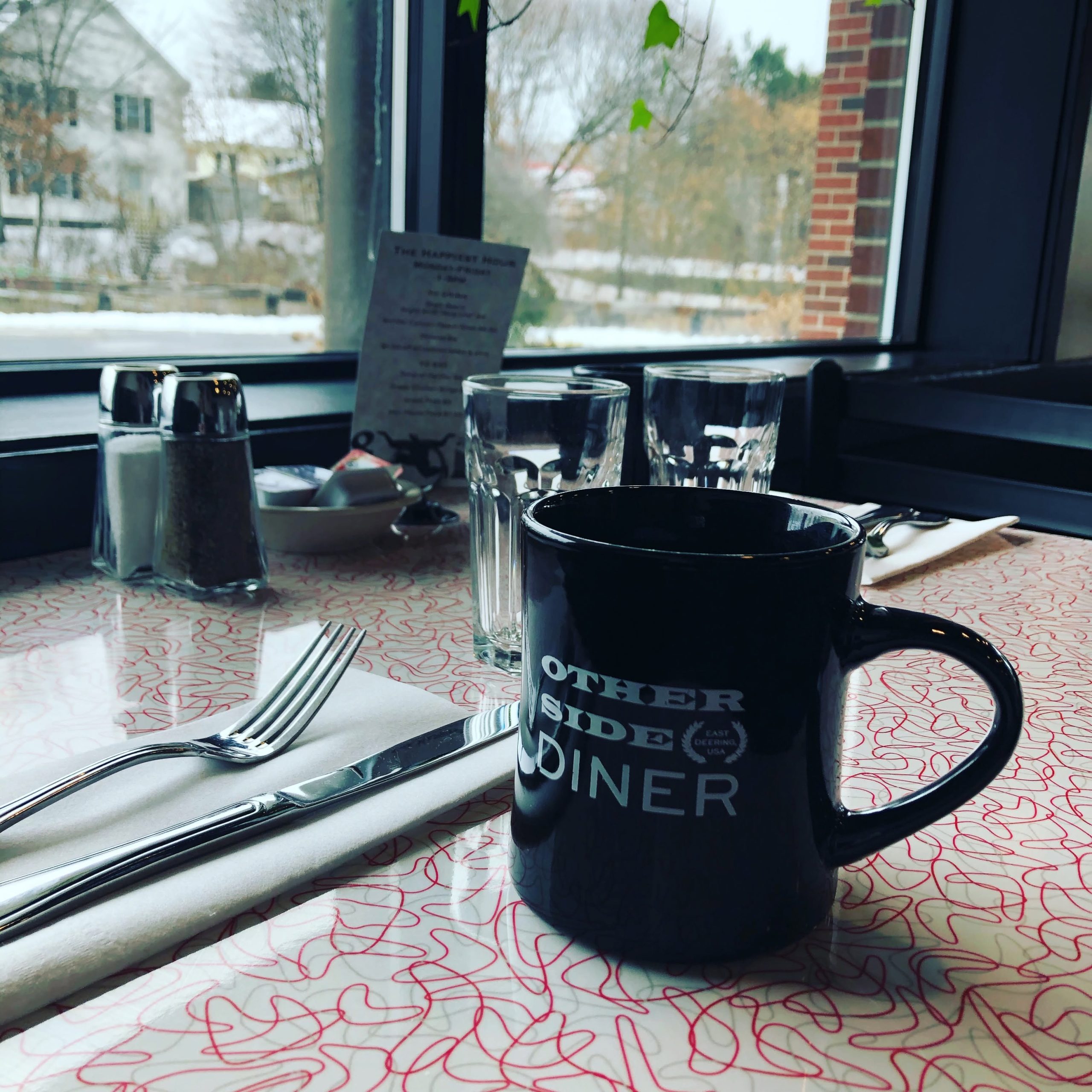Coffee by the window at Otherside Diner